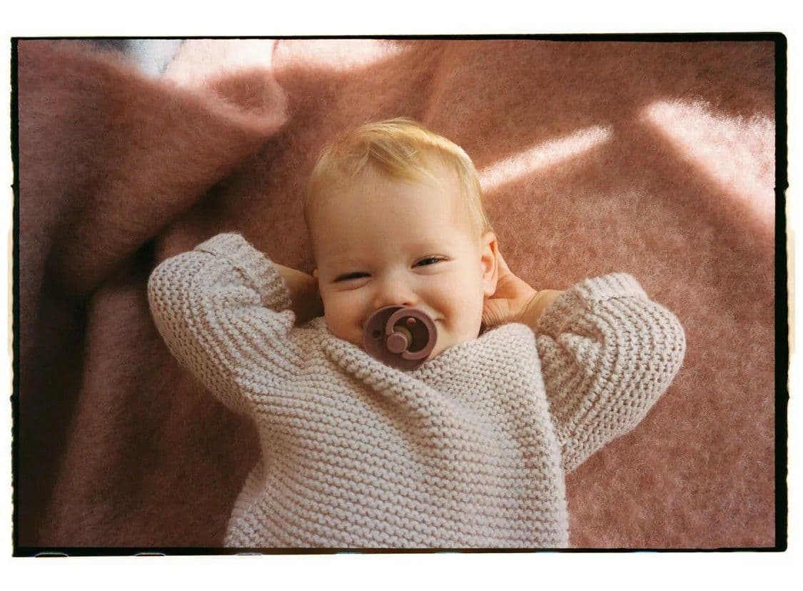 Happy baby with pacifier